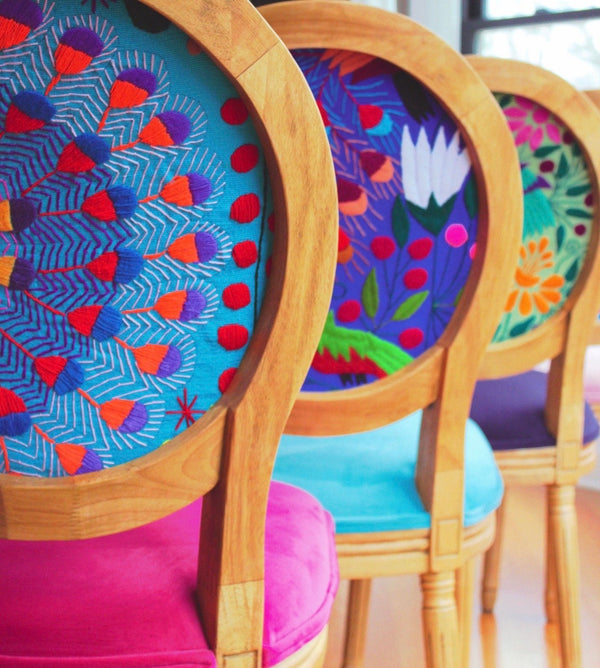 3 round back dining chairs with colorful velvet seats and hand embroidered tops.  Tops are each a different color with different birds and flowers.